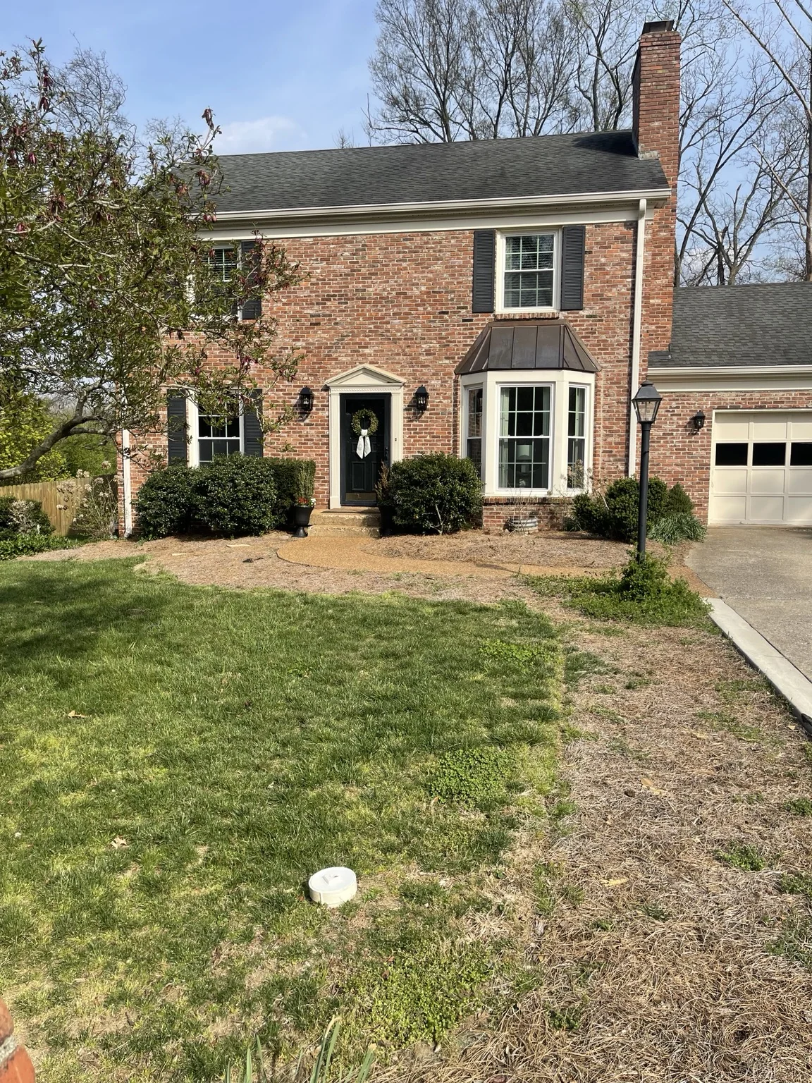 Residential front yard before landscape renovation