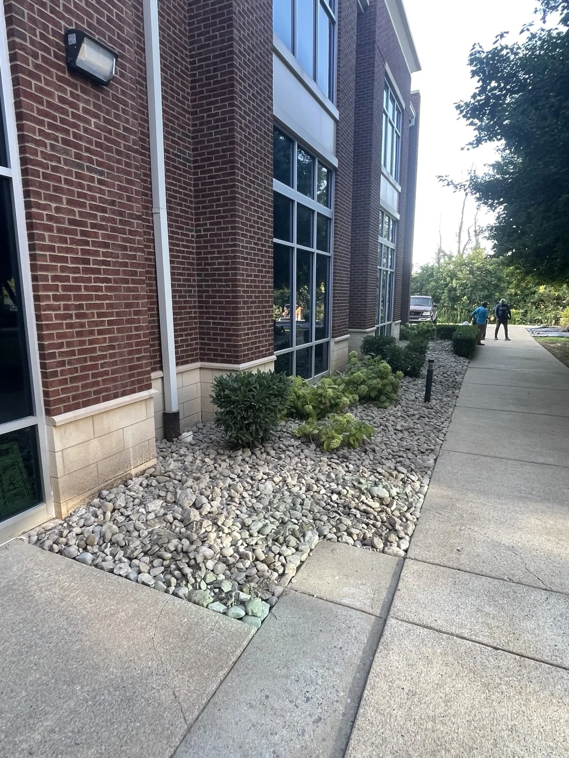 Commercial landscape bed after river rock installation